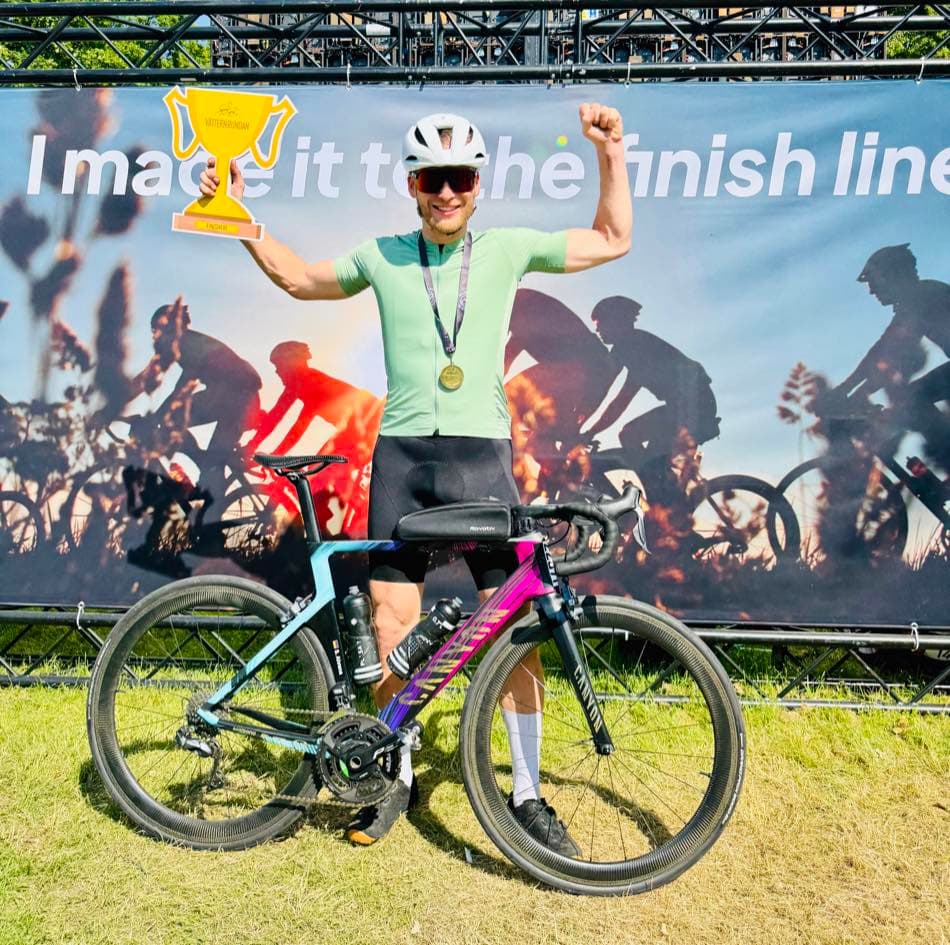 Holding a trophy at a cycling finish line